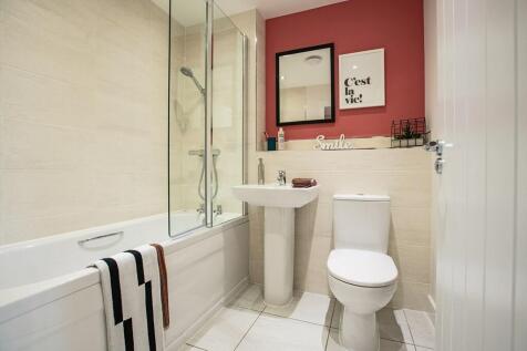 Family bathroom complete with shower over the bath