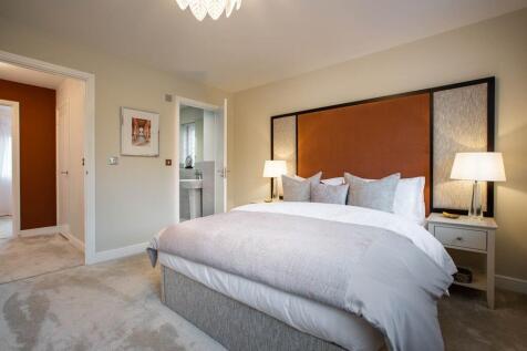 Bedroom one is spacious and tranquil, with an en suite shower room