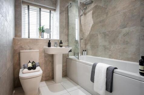 A stunning neutral bathroom invites you to relax