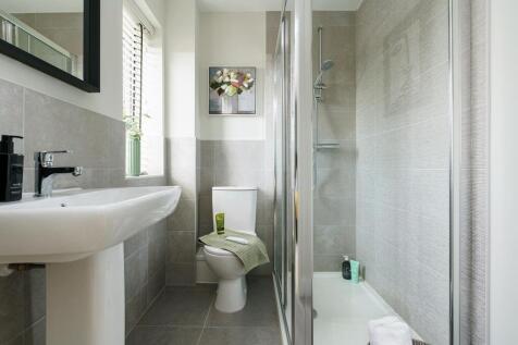 The main bedroom boasts its own en suite shower room