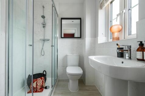 Bedroom 1 boasts an en-suite shower room