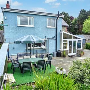 Rear of property with patio
