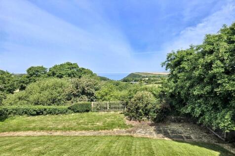 Garden and sea views from decking