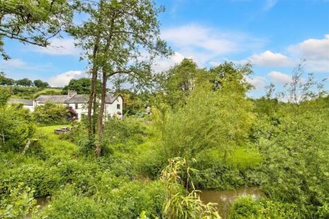 House, gardens and river