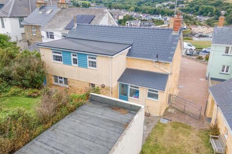 Aerial view of house and beach