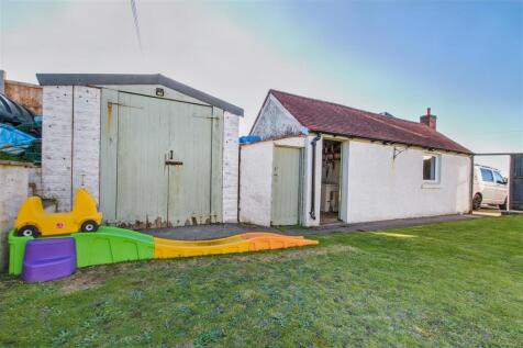 Detached garage and store sheds