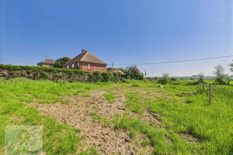 Land Adjacent To The Side Of The Property