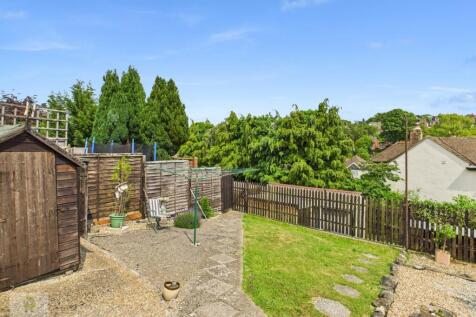 Rear Garden Looking Towards Garage And Parking
