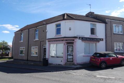 Front..Access to Shop and Apartment