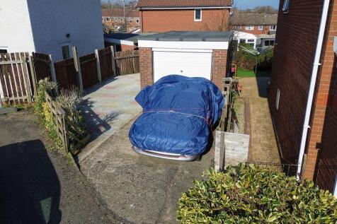 Garage And Extra Paved Area