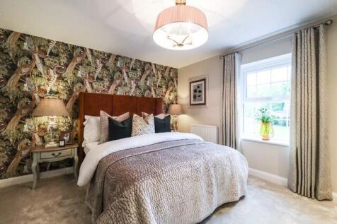 Double bedroom with nature theme wallpaper