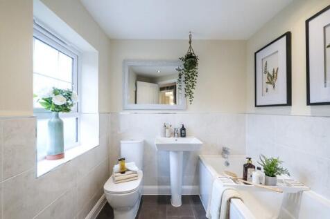 White half tiled bathroom