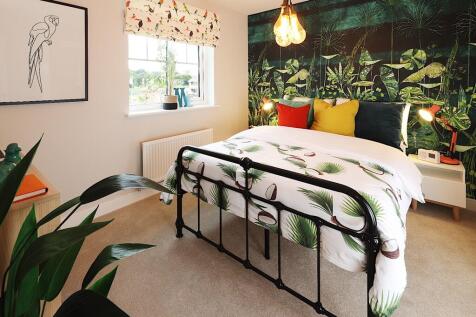 Large windows keep the bedrooms light and airy