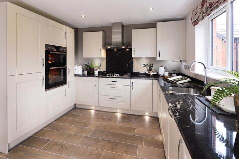 The kitchen has plenty of built in storage