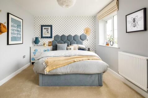 Bedroom 2 is light and airy