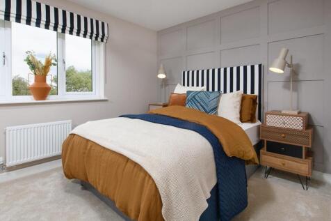A spacious double bedroom with space for storage