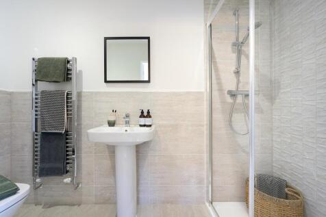 En suite to bedroom 1 with full width shower cubicle