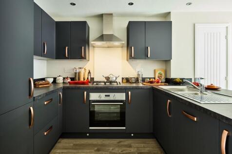 Kitchen is modern with ample storage