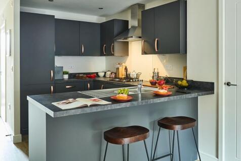 The peninsula island separates kitchen and living areas seamlessly