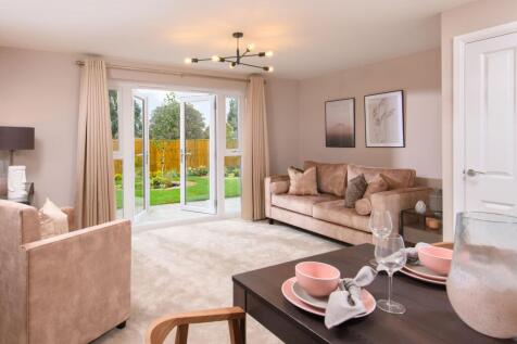 Internal image of the lounge/dining room with french doors to garden