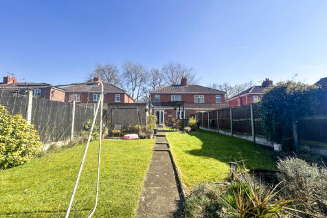 Charming Three-Bedroom Family Home with Modern Re