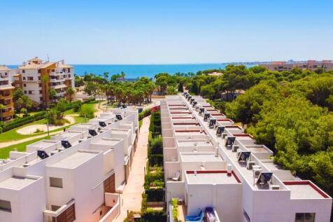 Punta Prima beach town house side