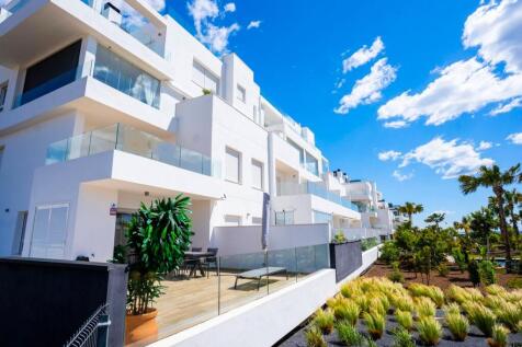 Punta Prima corner apartment with sea views