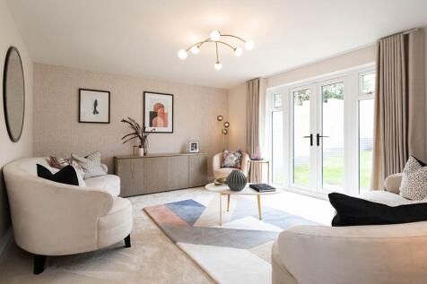 Open plan lounge with French doors opening to the garden