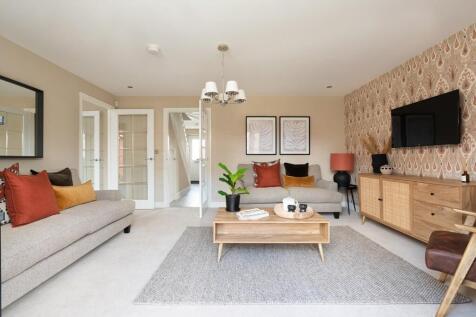 Open plan lounge with French doors opening to the garden