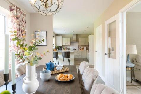 An open plan kitchen dining room is designed for family mealtimes