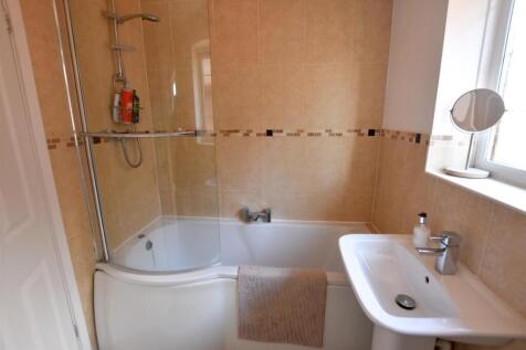 FAMILY BATHROOM WITH SHOWER OVER