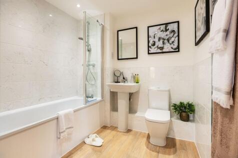 Family bathroom with shower over bath