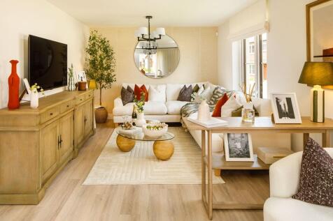 The large living room is spacious and features double aspect windows