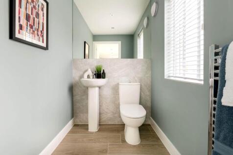 A guest cloakroom completes the ground floor