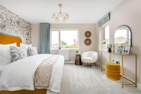 A spacious main bedroom offers plenty of room to relax