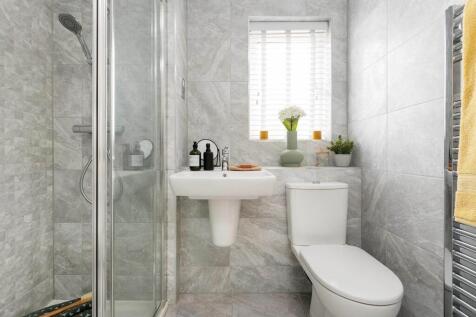Bedroom 1 hosts a private en suite show room