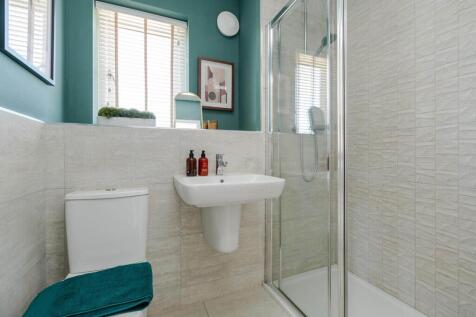 Bedroom 1 also hosts a private en suite shower room