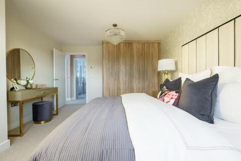 King size bedroom with ample space and en suite shower room