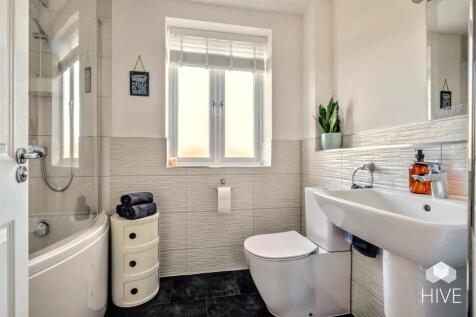 Family bathroom with shower over bath