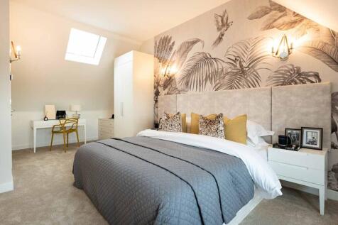 This impressive main bedroom occupies the entire second floor