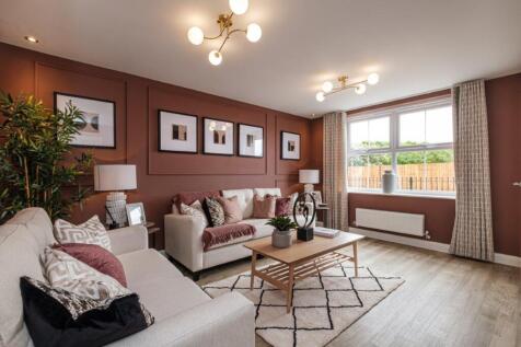 Photo of the lounge in the Archford, there&#39;s two sofas around a coffee table and a double window