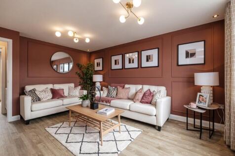 Photo of the Archford lounge, the walls are burgundy and two sofas face a coffee table