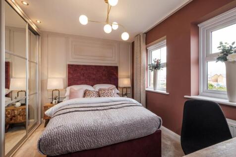 Photo of the Archford main bedroom, there are two windows and space for a double bed and a desk