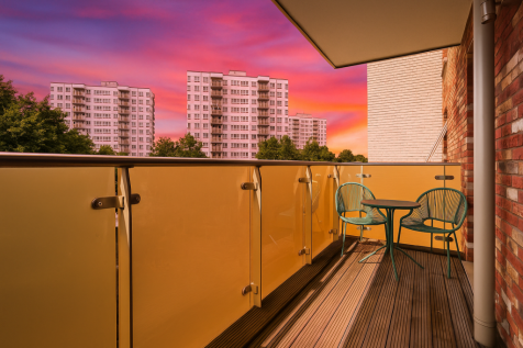 Sunset Over Urban Balcony Scene