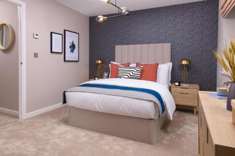 Relax and unwind in the spacious main bedroom