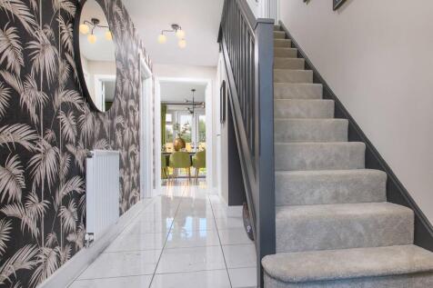 A welcoming hallway with storage cupboard