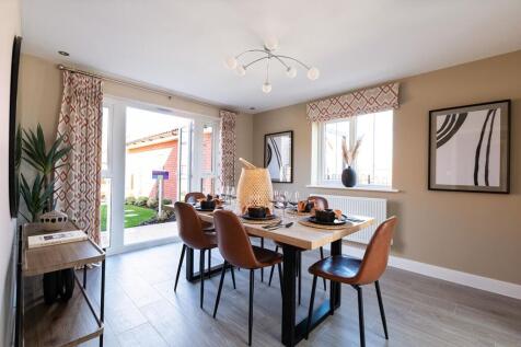 Both the dining room and living room feature French doors to the garden