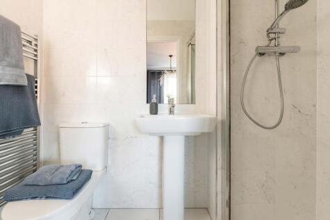 The main bedroom has an en-suite shower room away from the family