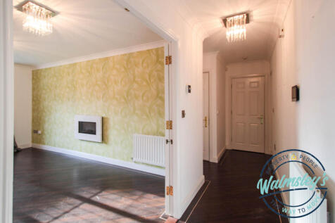 Sitting room with hallway &amp; doorways to cloakroom 