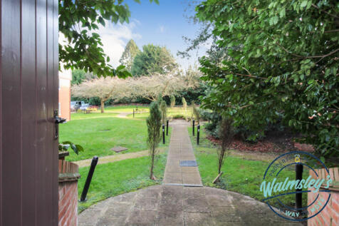 Communal gardens from parking area at front